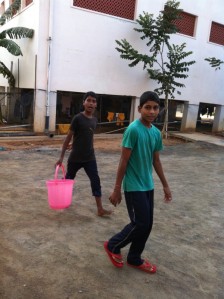 Early morning, and children carry out their chores at Paradise school
