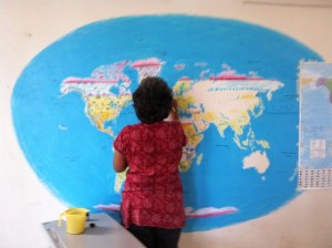 Bhavana captures artist Anita Rao working on her wall painting of the world map